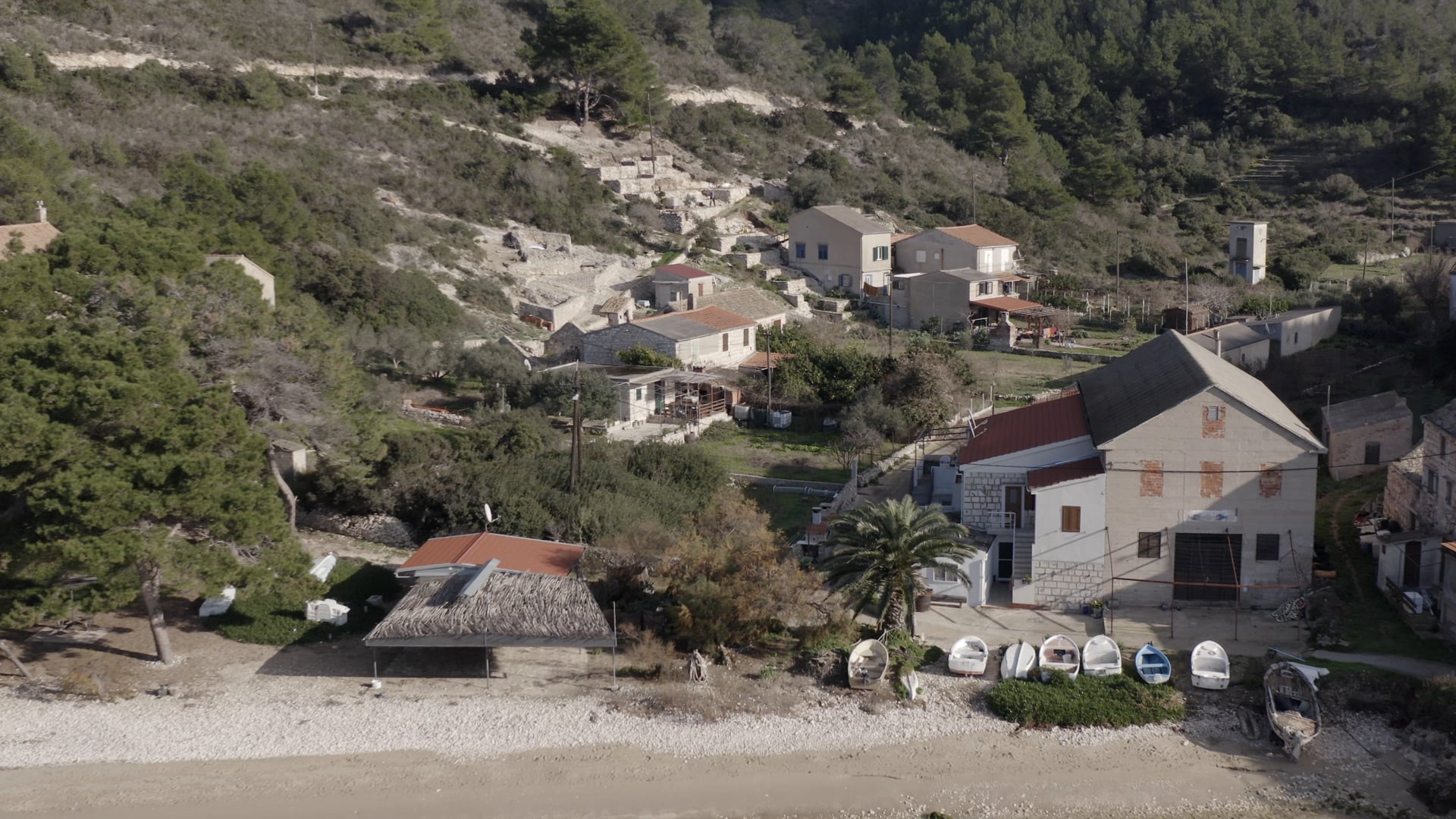 Beautiful beach, crystal clear blue sea, calm, few houses and gardens near the beach