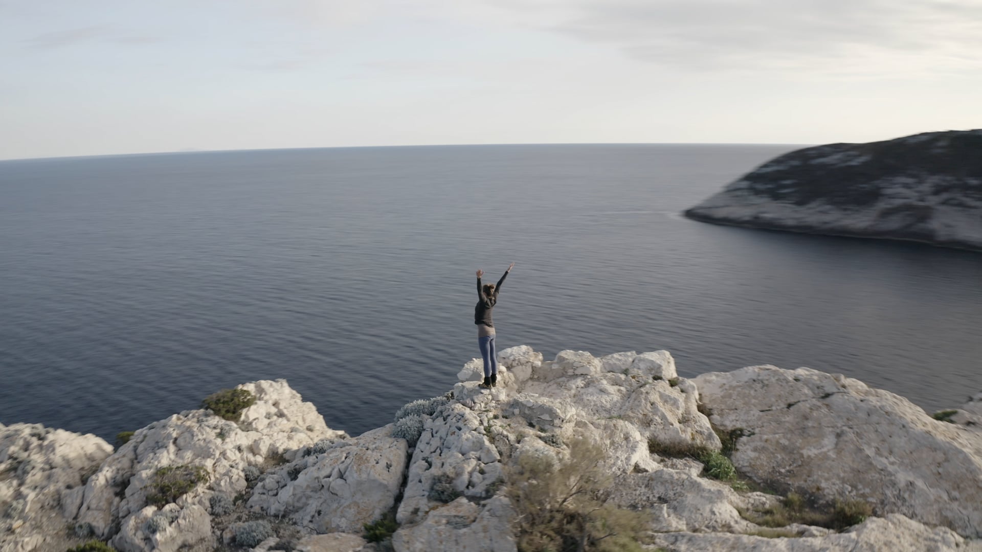 Woman doing yoga on the top of the cliff, fast 360° view