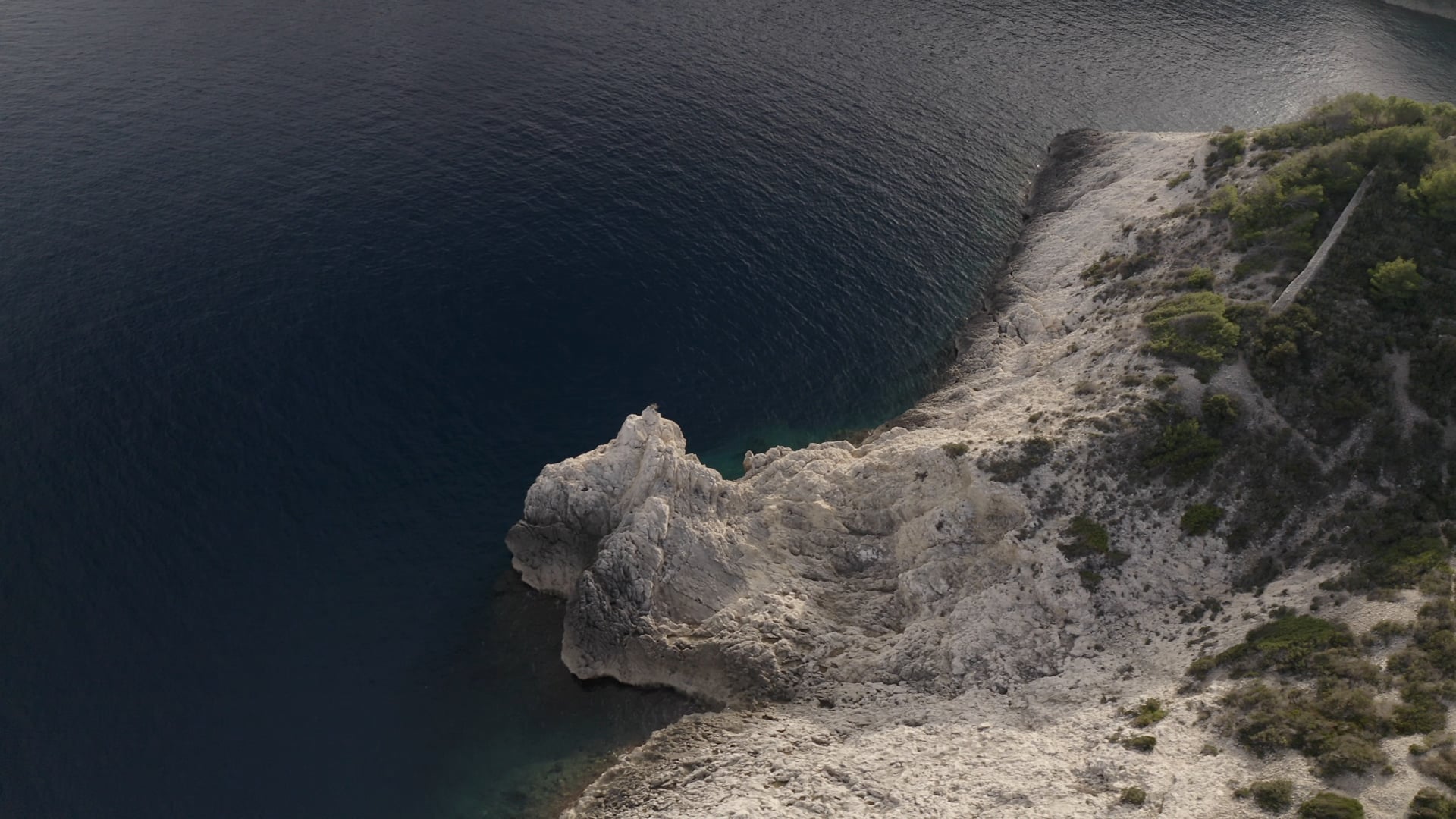 Small cliff near the crystal clear sea