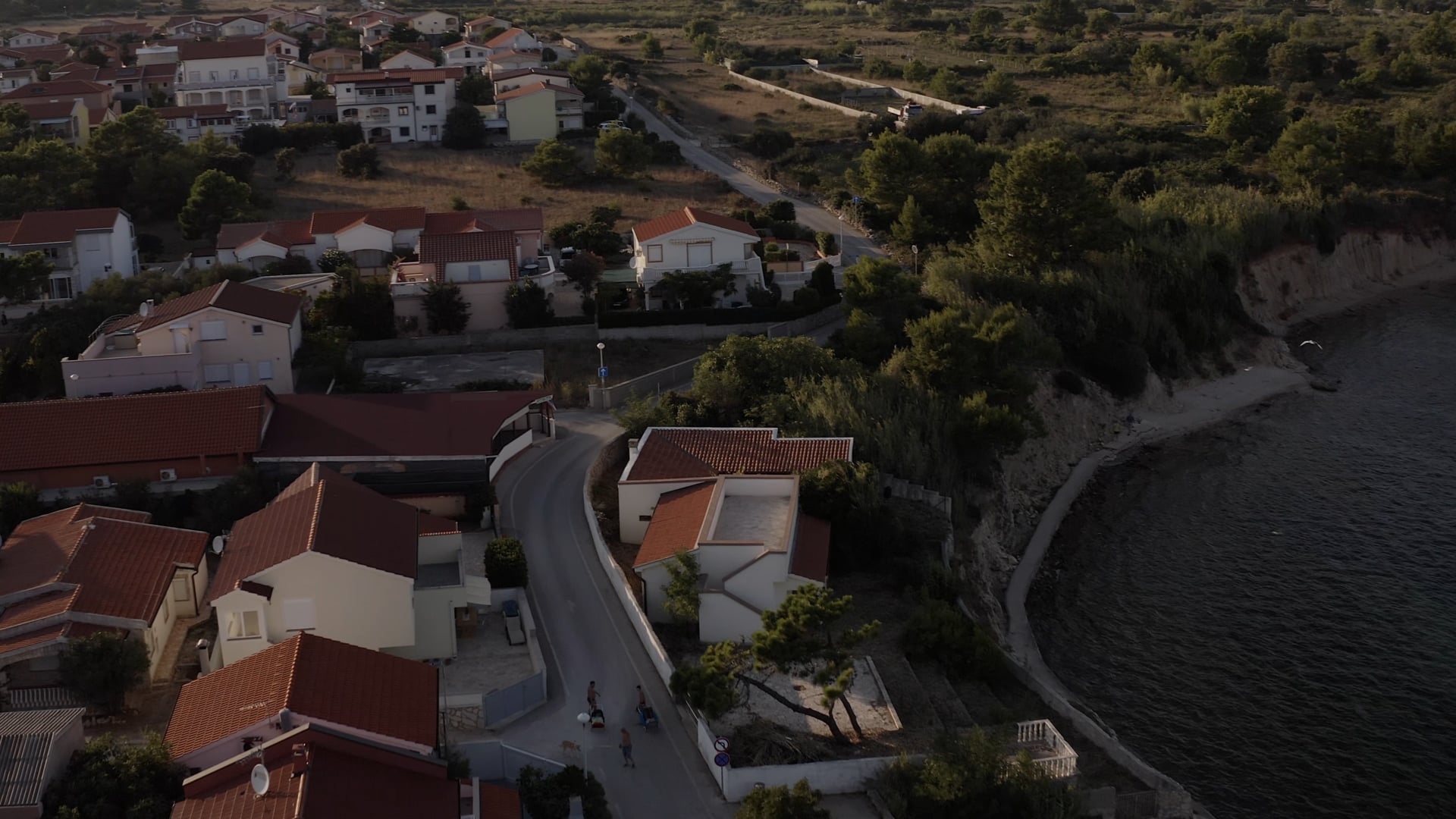 Road by the sea, houses near the road