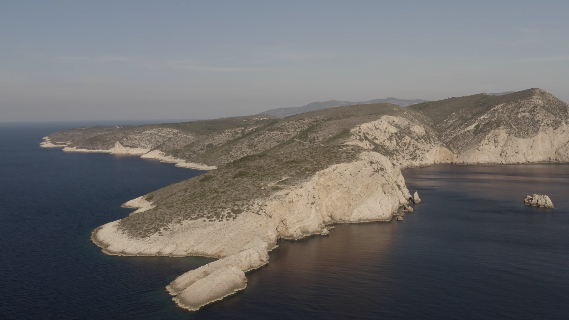 Stone island surrounded by the deep blue sea