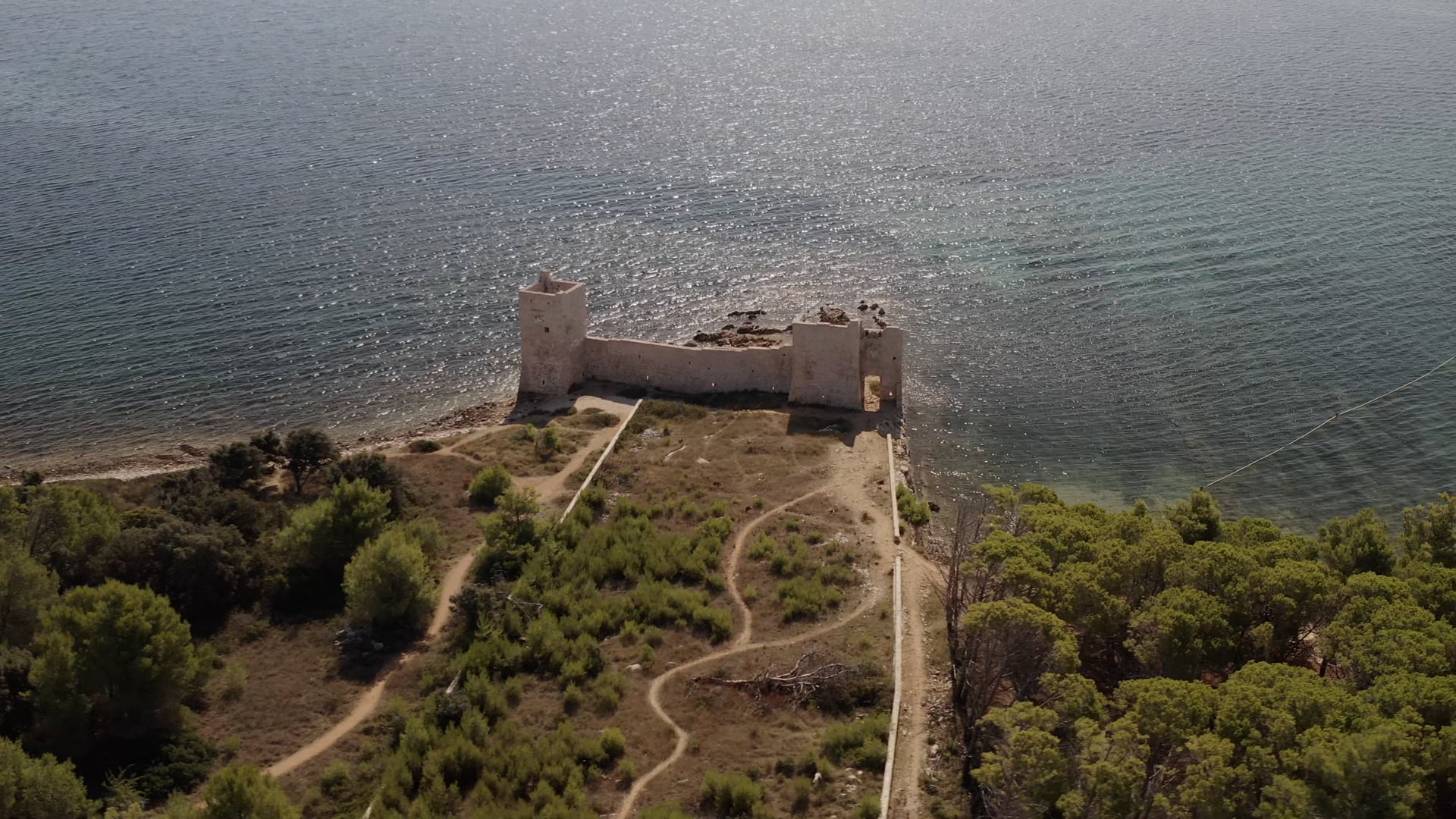 360° view of the abandoned castle close to the seashore close to the forest, beautiful blue sea