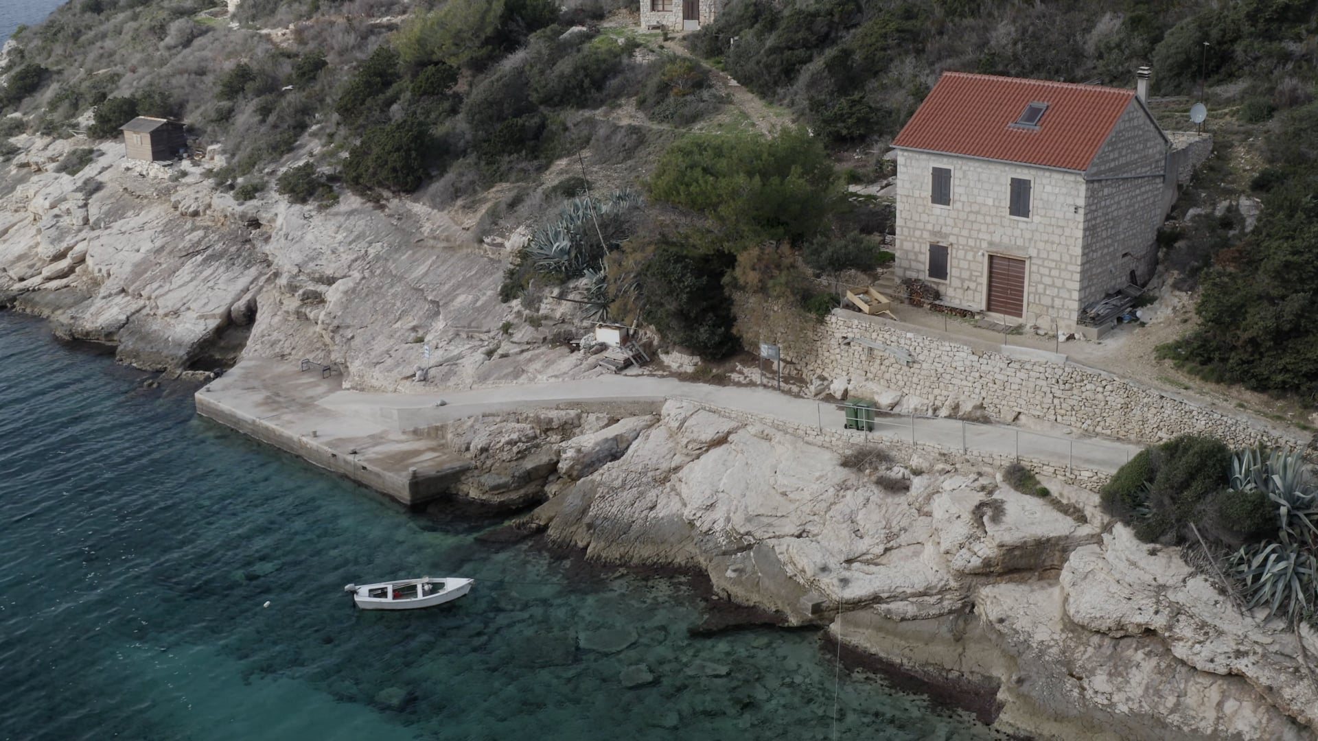 Small boat near the stone house