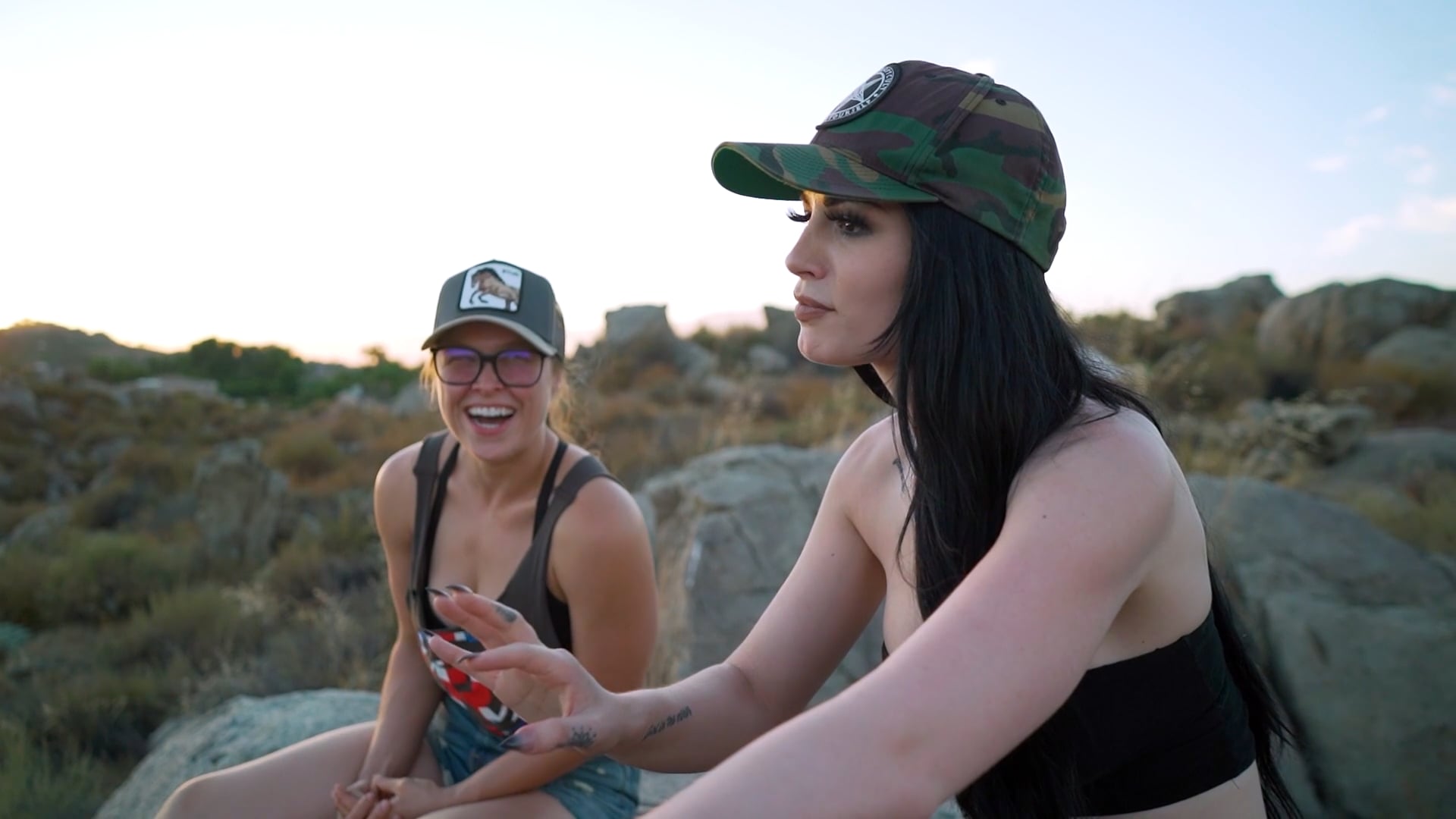 Ronda Rousey walks with WWE's Paige