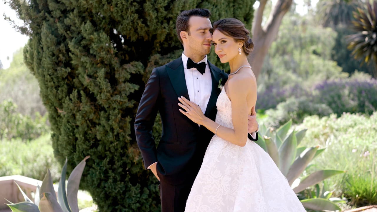Alexis and Michael together beside garden greenery