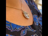 Medaglione di forma ovale con perle di granato 9k 14329-8309