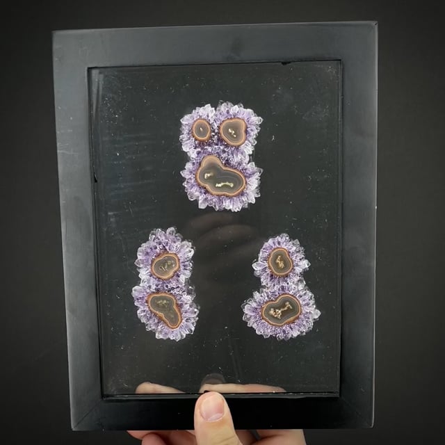 Framed amethyst stalactite slices