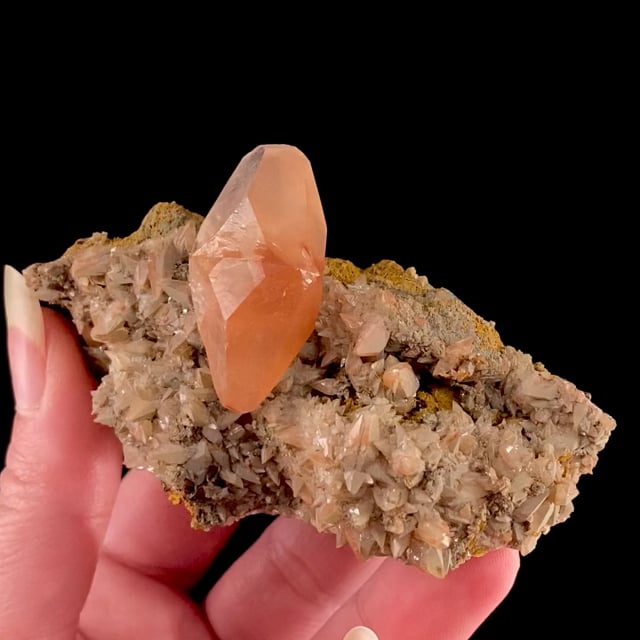 Calcite (doubly-terminated twin with iron oxide coating)