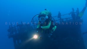 0221_female diver and ship wreck