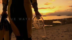 0542_scuba girl walking into sunset