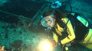 0576_female scuba diver close up ship wreck