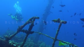 1598_female scuba diver swimming over shipwreck