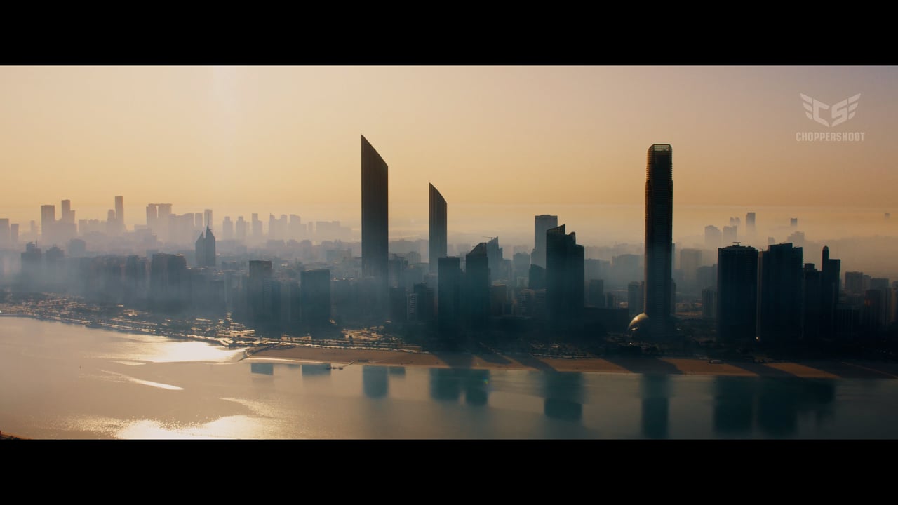 Abu Dhabi skyline and waterfront at sunrise, filmed from a helicopter by ChopperShoot