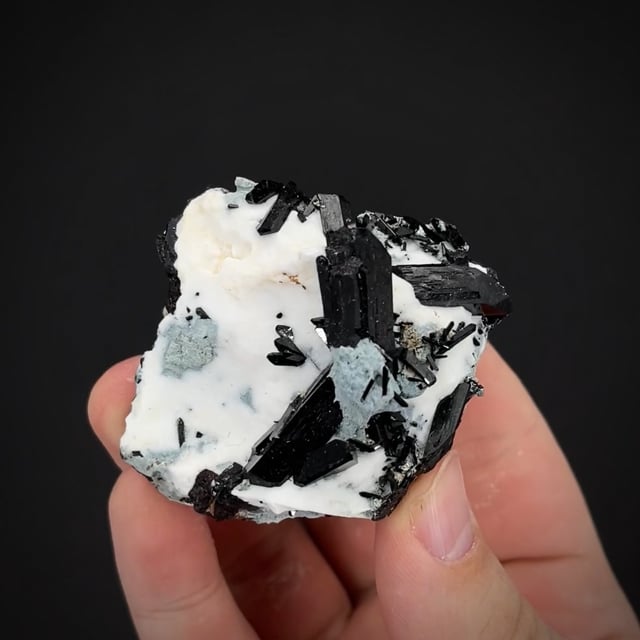 Neptunite on Natrolite