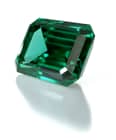 Three-Stone Engagement Ring: gold, emerald, diamonds
