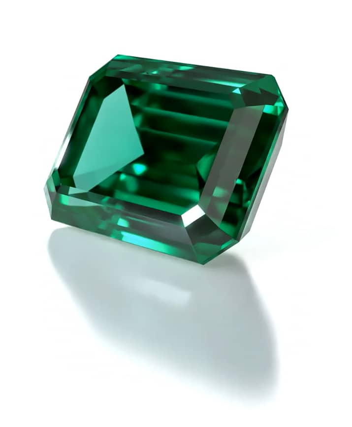Three-Stone Engagement Ring: white gold, emerald, diamonds