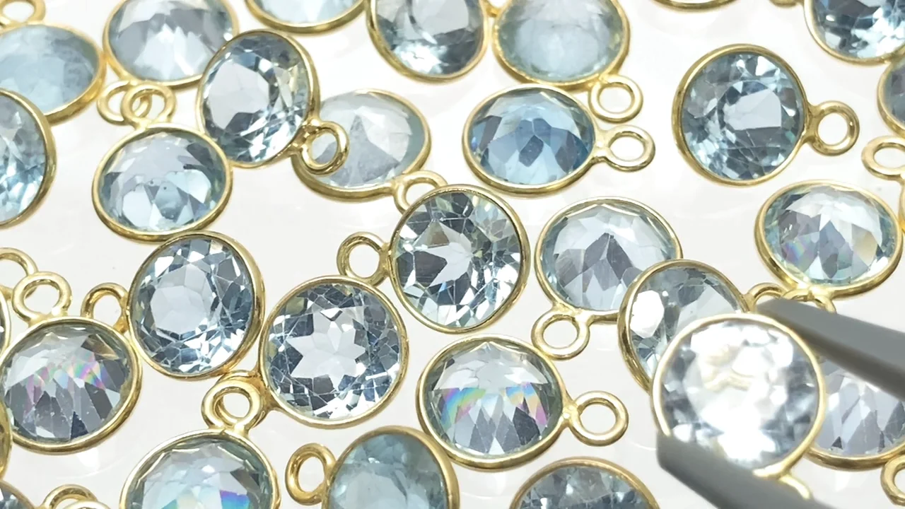 動画】宝石質スカイブルートパーズAAA 枠留めラウンドファセットカット