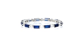 40 ct. t.w. Simulated Sapphire and .20 ct. t.w. CZ Eternity Band in Sterling Silver