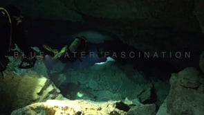 1377_Scuba divers swimming trough Cenote Tajma Ha, Yucatan Mexico.