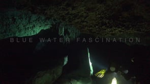 1382_divers illuminating stalagtites inside cenote Tajma Ha, Yucatan Mexico