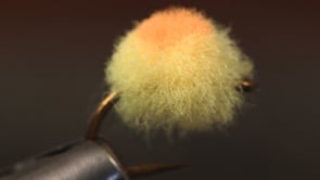 A fly vise holding a undefined after it is tied