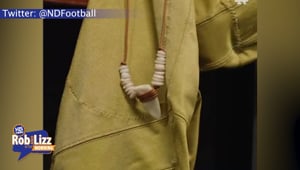 College Quarter Back Wears His Rib Bone as a Necklace