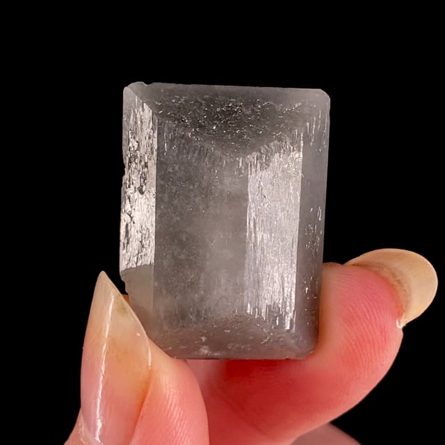 Danburite included with Magnesioriebeckite (''floater'' crystal)