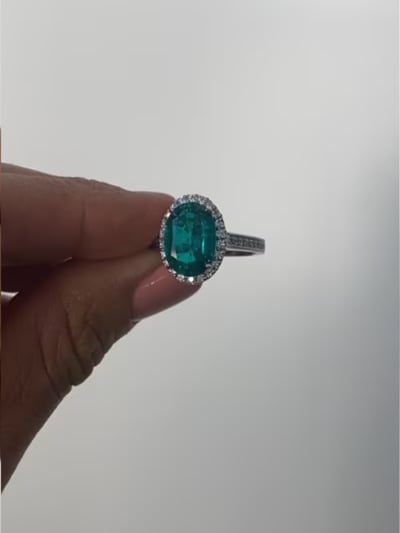 Oval Emerald Micropave Halo Ring (4.75 TCW)
