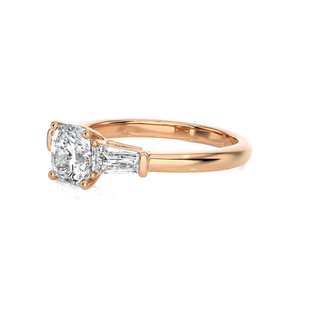 1.00 carat trilogy ring in red gold with a lab grown cushion diamond and lab grown tapered baguettes