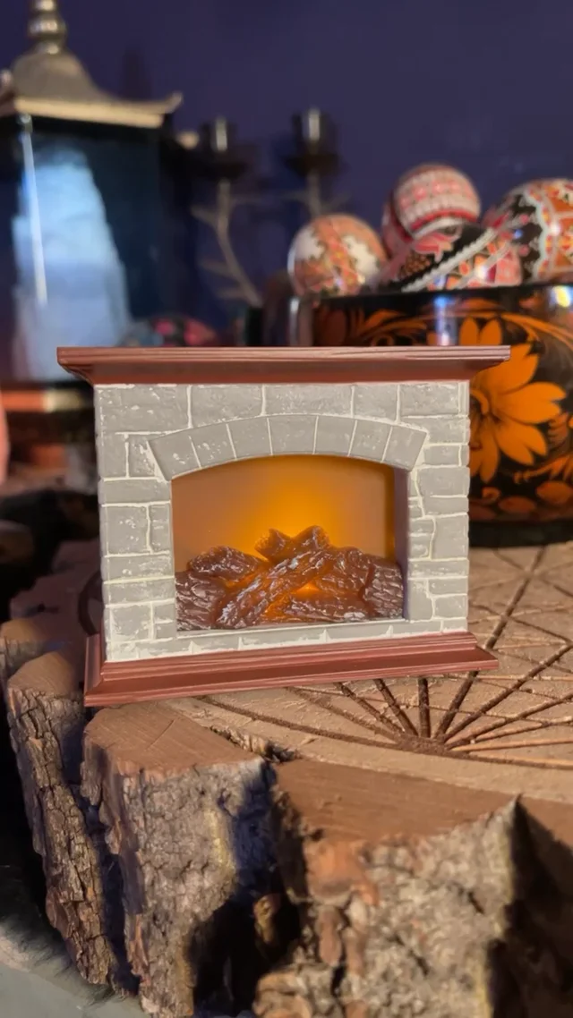 Mini Yule Log: A tiny electric fireplace with light and sound.