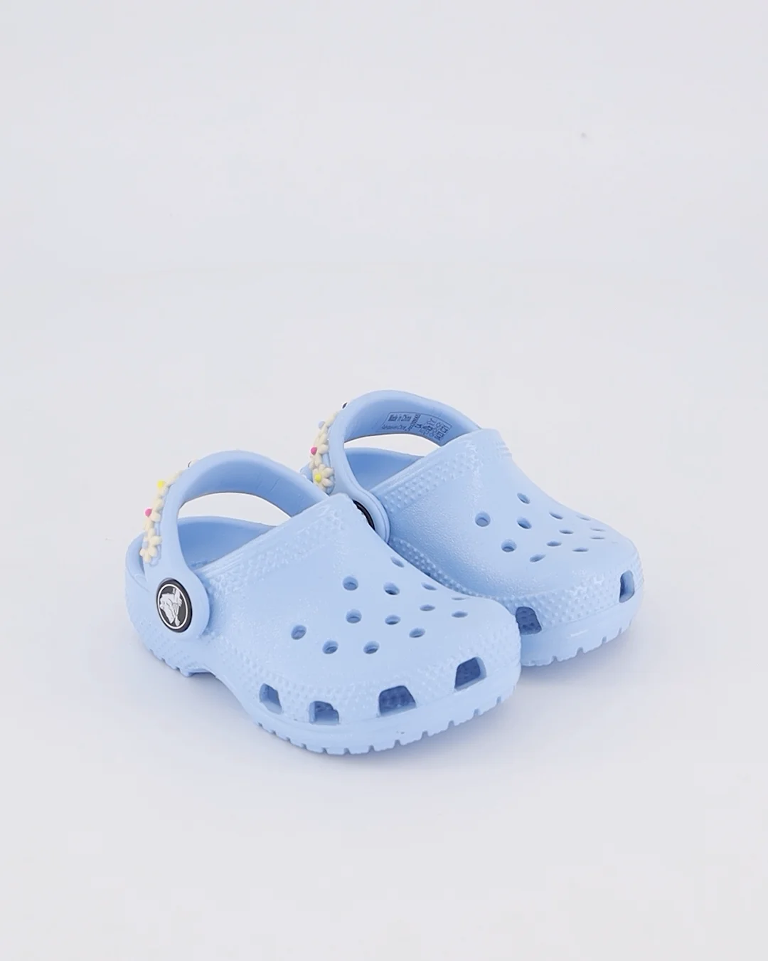 Shop Crocs Toddler Classic Clog Daisy Chain in Blue.