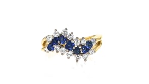 C. 1986 Vintage .75 ct. t.w. Sapphire and .60 ct. t.w. Diamond Wave Ring in 18kt Yellow Gold with British Hallmark