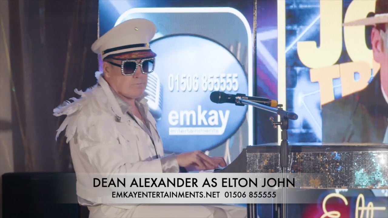 Dean Alexander as Elton John