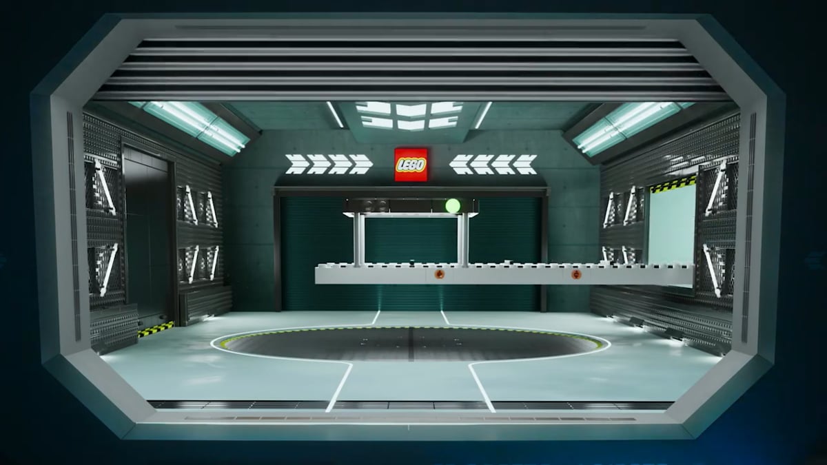 Film still: a dimly lit reveal stage framed by LEGO signage, from “Lego Make Dream Cars Real”.