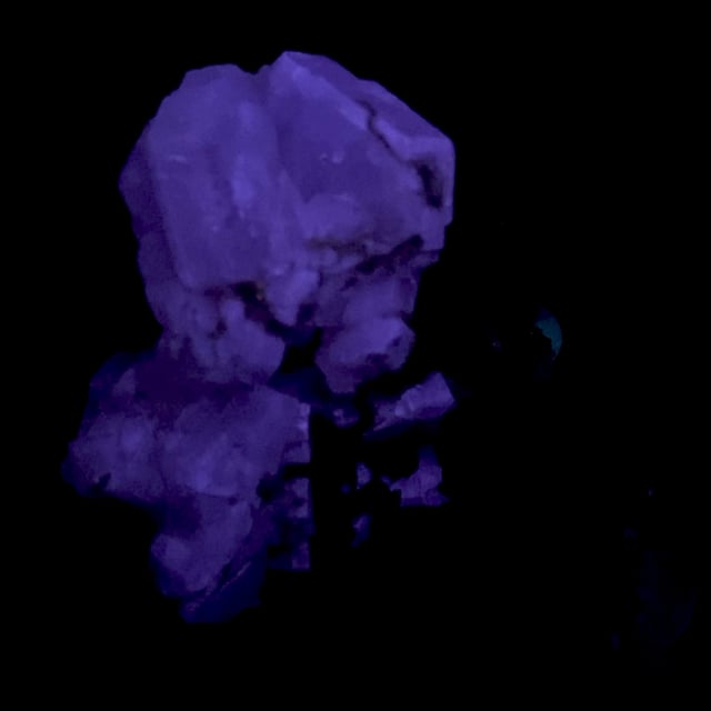 Fluorapatite (unique fluorescence)