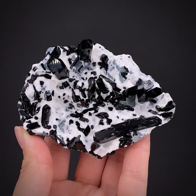 Neptunite on Natrolite