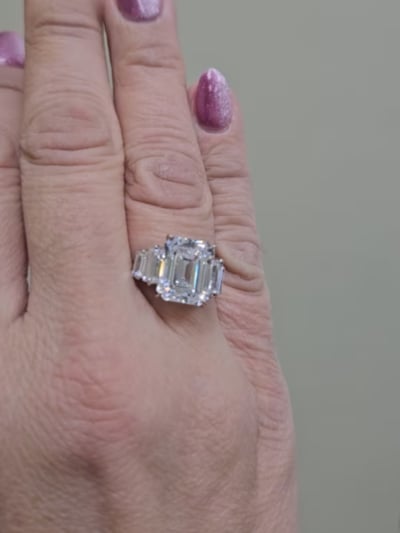 4.5ct Emerald Cut Center  with 4 Graduated Baguettes of .75 TCW on the sides. Center stone size: 11x9mm F218-CZ-14K
