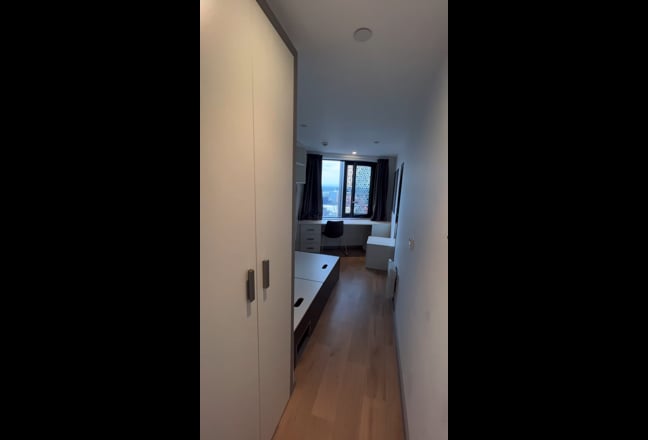 Video 1: There is one small-double-size bed in the room with mattress, and a private bathroom. Shared kitchen