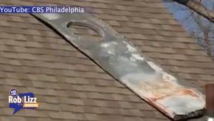 Plane Piece Lands On Couple's Roof