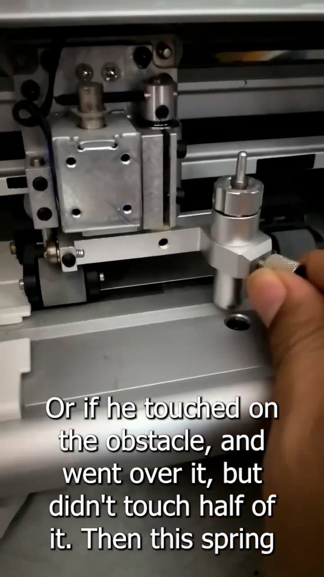 V-Smart Vinyl Cutter, on carriage, the electromagnetic push blade down, and the spring is to lift it