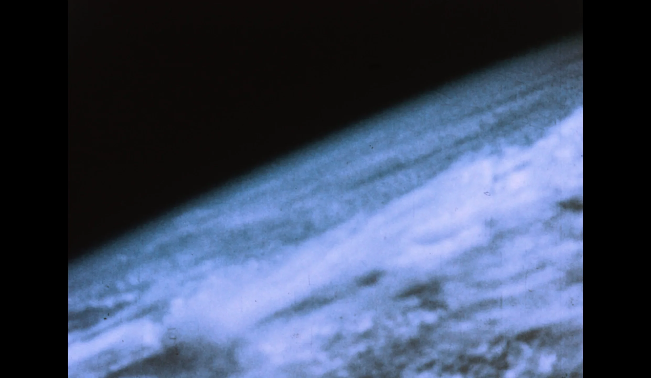 First Pictures: Color View of the Earth & A Tropical Depression