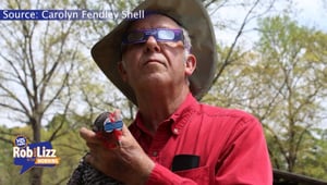 Man and His Chicken Watches The Eclipse