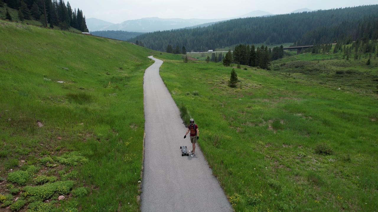 Sergio & Derek Skateboarding with Drone - trees Copper to Vail