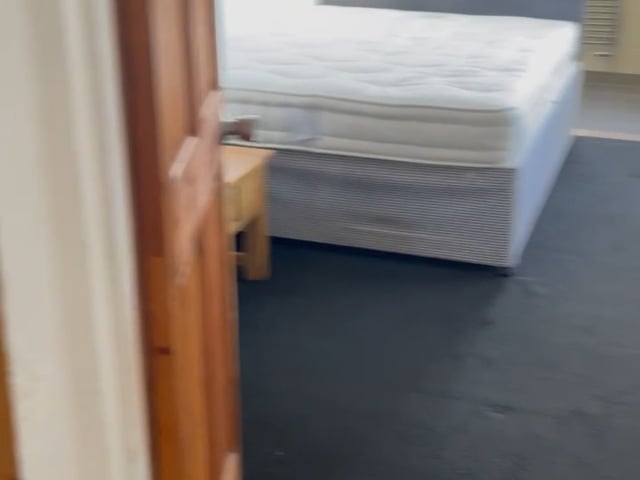 Video 1: Part of bedroom showing private lounge through door.