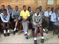 Girls in Namasanda learning how to create sanitary pads