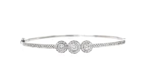 C. 1990 Vintage 1.25 ct. t.w. Diamond Cluster Bangle Bracelet in 14kt White Gold