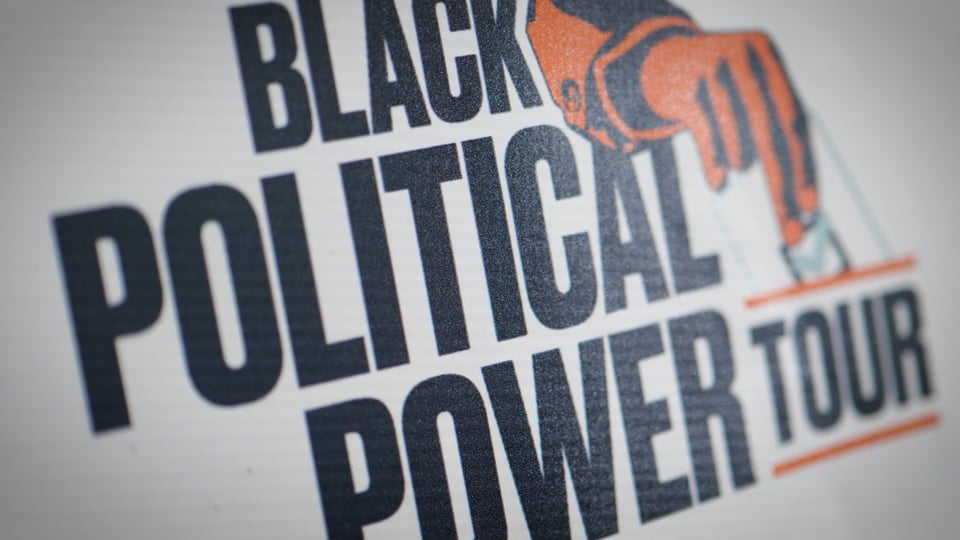 Close-up of the Black Political Power Tour logo featuring bold typography and an illustration of a hand casting a ballot.