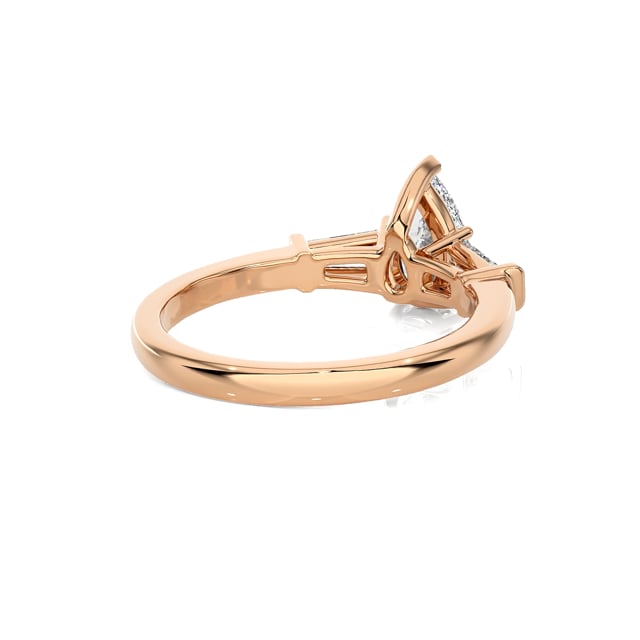 1.00 carat trilogy ring in red gold with lab grown pear diamond and lab grown tapered baguettes