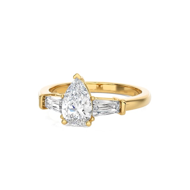 1.00 carat trilogy ring in yellow gold with lab grown pear diamond and lab grown tapered baguettes