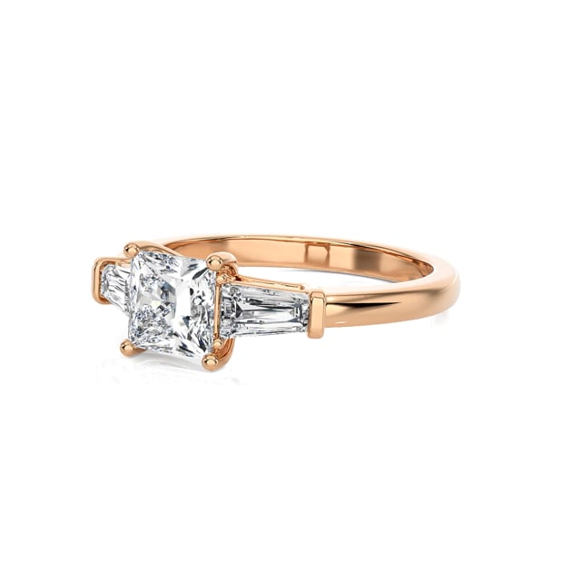 1.00 carat trilogy ring in red gold with a lab grown princess diamond and lab grown tapered baguettes